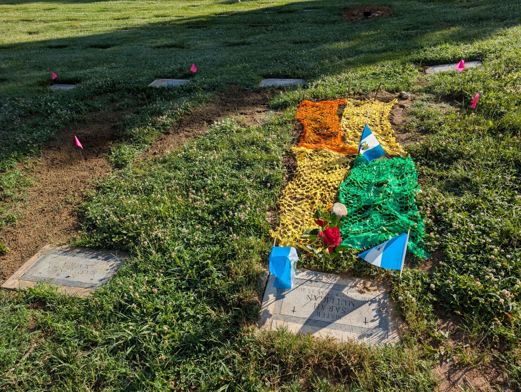 Guatemalan flag colors laid over Sr. Sarah Mulligan's grave